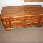 Cedar chest which contains the laundry chute. 