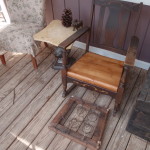 Remnant black locust flooring seat used on outdoor rocking chair